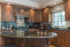 A beautiful kitchen with a curved flooring which guides visitors to the other side of the island away from the dangers of the cooking areas enclosed. 35 Curved Kitchen Island Ideas Photos Home Stratosphere