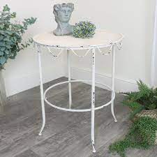Distressed finish loney coffee table with storage. Cream Distressed Iron Side Table