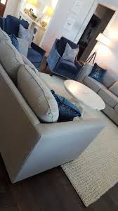 Contemporary Gray Linen Couches Paired With Blue Velvet Accent Chairs Make For A Visually Pl Blue Velvet Accent Chair Grey Couch Living Room Blue Accent Chairs