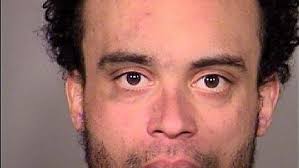 Man climbs into backseat of unoccupied police car, falls asleep, goes to  jail