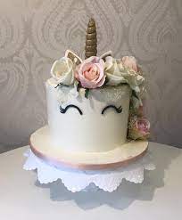 Unicorn cake with fondant flowers. Beautiful Floral Unicorn Cake With Gold Glitter Horn And Pink Cream And Peach Synthetic Flow 21st Birthday Cakes Unicorn Birthday Cake Cake Decorating Designs