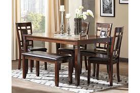 The bench is straight out of a country cottage. Bennox Dining Table And Chairs With Bench Set Of 6 Ashley Furniture Homestore