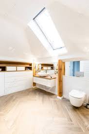 window above white sink near toilet in