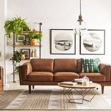 The Sharped Edged Brown Couch Provides Contrast To This Design There Ar Mid Century Modern Living Room Decor Modern Living Room Brown Living Room Decor Modern