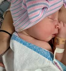 Lucy Maia, Emma's long-awaited baby sister, joined us earthside early  Friday morning. She has lots of hair, squeaks a lot, and we think she's  perfect! Lucy means “as of light,” and that's