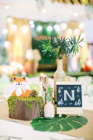 I love the rustic yet elegant feel of this outdoor woodland dinner party! Woodland Party Table Centerpieces From A Woodland 1st Birthday Party On Kara S Party I Woodland Party Theme Forest Birthday Party Birthday Party Centerpieces