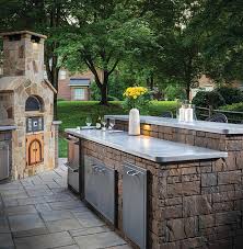 Adding a propane grill and simple patio table and chairs get the job done with a quaint, comfy sitting area to entertain. Outdoor Kitchen Ideas Designs Outdoor Fireplace Pictures