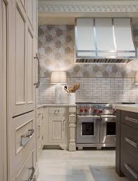 white kitchen with modern aire hood st