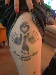 This is one of the best baby tattoos for guys that shows a cute sleeping baby. Pin On Handprint And Footprint Tattoo