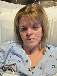 Savanah Brown gets a quick hand massage before doctors discharge her from  the hospital. Sh came to Methodist Hospital's emergency department this  week due to shortness of breath and coughing up blood.