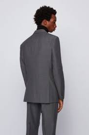 Indossava un completo di hugo boss grigio antracite.: Abiti Business Da Uomo Grigio Hugo Boss