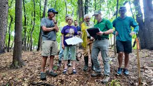 Conservation commissioners walk proposed site of 17-unit ‘starter housing’ development near Salmon Brook