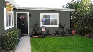 Grey Stucco House With White Trim Black Glossy Door Stucco Homes House Designs Exterior Stucco House Colors