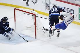 Winnipeg jets center mark scheifele (55) warms up before the game against the calgary flames at scotiabank saddledome. Xe0mzlkye9bcym