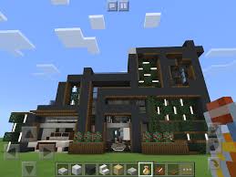 the front of a modern house in 2021 minecraft architecture cool minecraft houses minecraft houses