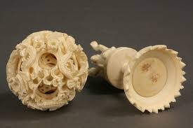 The concentric pierced ball carved with scrolling rose sprays, containing balls pierced with a geometric pattern, the stand carved with a cockerel beside a pine tree. Lot 430 Asian Carved Ivory Puzzle Ball Case Antiques