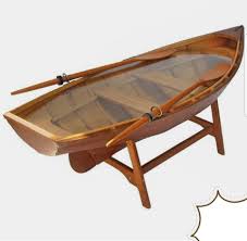 This coffee table sized little rowboat looks very authentic. Boat Shaped Coffee Table Wood And Beyond The Decor Facebook