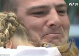 Soldier father surprises daughter, 5, and makes her school's story time  book Hero Dad come to life