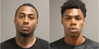 Men charged with robbing pair