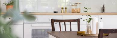 No one will guess that this chic, extendable kitchen table is from ikea. Contemporary White Kitchen With Wooden Table And Two Chairs Panorama Image Stock By Pixlr