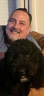 Can someone turn this picture of my husband and his dog into a Christmas  picture?