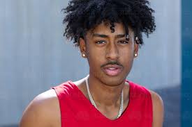 Check out these hottest shoulder length hairstyles that will revitalize your look! Image Of Head And Shoulders Of Young Man With A Mop Of Black Hair Looking Intently Into The Camera Austockphoto