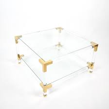 Lucite and brass coffee table. Maison Jansen Paris Lucite And Brass Coffee Table