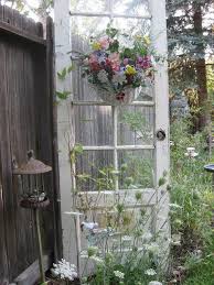 I think it's particularly striking with the contrast of the painted doors and stained wooden top rails. 20 Most Beautiful Vintage Garden Ideas Diy Crafts Blog Vintage Garden Decoration Cottage Garden Garden Doors