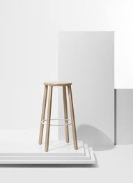 It has a curved surface which tapers (i.e. Cone Stool Minimalgoods