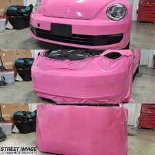 Light grey vinyl car wrapping. Volkswagen Wrapped In Gloss Hot Pink Vinyl