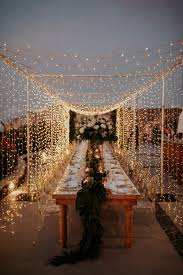 A Magical Wedding In Santorini Under A Canopy Of Fairy Lights Ruffled Wedding Lights Magical Wedding Santorini Wedding