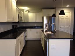 Kitchen With White Shaker Cabinets Black Quartz Countertops Stainl Black Quartz Countertops Quartz Kitchen Countertops White White Cabinets White Countertops