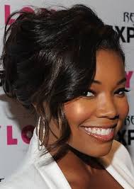 Center bun hairstyle for black women. Updo Hairstyles For Black Hair
