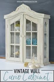Designer alexander doherty breaks down his top pointers for displaying collectibles in corner curio cabinets. Whitewashed Vintage Wall Curio Cabinet Interior Frugalista