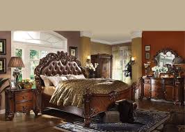 This set includes two chairs, each with a frame that's crafted from solid hardwood. Vendome Bedroom Set In Cherry Finish By Acme Furniture
