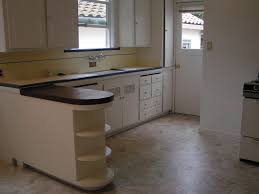 The simple kitchen design like this is a great choice to have, you only need 2 or 3 cabinets and stove as the kitchen area, that's it! Home Architec Ideas Elegant Kitchen Design Ideas