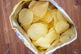 Fold the right and left side of the bag towards the middle allowing the corners to meet at the center. Potato Chips In Open Snack Bag Close Up On Table Floor Stock Photo Picture And Royalty Free Image Image 105216055
