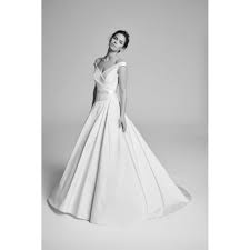 The fitted bodice (or corset) helps slim the torso and cinch the waist, while the voluminous. Suzanne Neville Dropped Waist Cavetto Wedding Dress Full Skirt