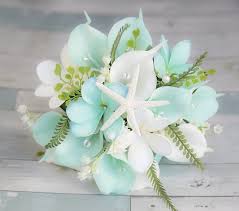 It is full of bright and colorful wildflowers and blossoms. Beach Wedding Bouquet Tropical Bouquet Silk Wedding Bouquets Real Touch Bouquet Aqua Bouquet Turquoise Bouquet Beach Wedding Flowers Silk Flower Wedding Bouquet Beach Wedding Flowers Silk Wedding Bouquets