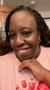 Styling black cardigan and silver heart earrings