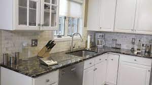 These unique kitchen types of granite countertops are black pearl granite and an angled ceiling. Top 5 Kitchen Countertop Choices For White Cabinets Marble Com