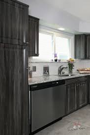 This Kitchen Features Cabinets In Our Exquisite Merapi Color With Stylishly Distressed Woo Best Kitchen Cabinets Finish Kitchen Cabinets Grey Kitchen Cabinets
