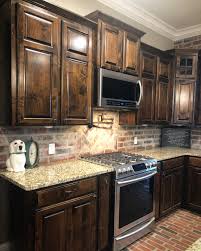 Brick Backsplash Light Sack Finish Alder Cabinets With Dark Walnut Stain Stained Kitchen Cabinets Dark Wood Kitchen Cabinets Backsplash Kitchen Dark Cabinets