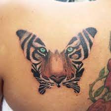 Tiger Butterfly Tattoo By Daniel Delfin Tiger Butterfly Tattoo Butterfly Tattoo Designs Butterfly Tattoos For Women