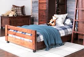 A curved headboard and footboard. Sedona Twin Caster Bed Living Spaces
