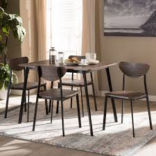 The tulip chair looks delectable as a dining chair with minimal modern furnishings and a table that is subtle enough to let this chair do. Baxton Studio Ornette Mid Century Modern Matte Black Frame 5 Piece Dining Set D01178s 5pc Dining Set