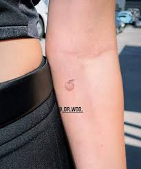 Justin bieber s new fish tiger and angel tattoo 2013 justin bieber s. Justin Hailey Bieber Get New Peach Couples Tattoo