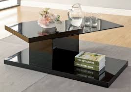 Its tempered glass top sits atop four sleek rounded legs, which in turn sit atop white manufactured wood legs, with a tempered glass lower shelf perfect for hosting extra magazines or. 20 Inimitable Styles Of Swiveling Glass Coffee Table Home Design Lover