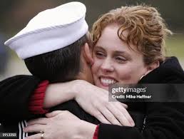 Colleen Mathias welcomes home her husband Petty Officer Mike Mathias...  News Photo