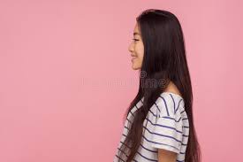 One of my friends told me that asian hair dyes are much more gentle and less damaging to your even though i have shoulder length hair, i have pretty thick hair so i think you should be pretty safe. Side View Of Cheerful Pretty Asian Girl With Long Brunette Hair In Striped T Shirt Looking At Copy Space With Smile Stock Photo Image Of Asian Hair 174245862